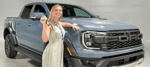 Bill Brown Ford Sales Rep Melissa in front of 2024 Raptor Ranger