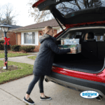 Getting presents out from the back of a 24 Edge Titanium from Bill Brown Ford