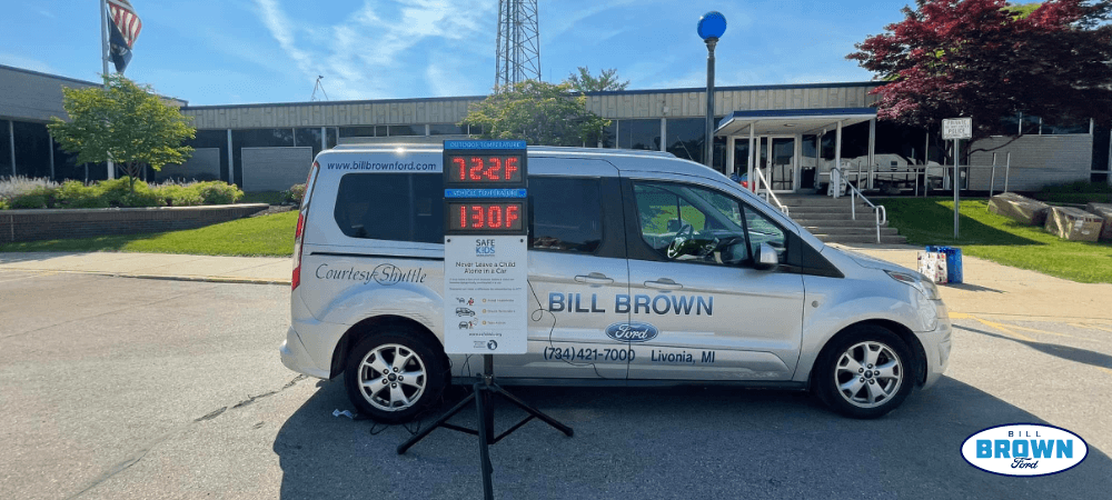 Bill Brown Ford testing the temperature inside a vehicle in the heat