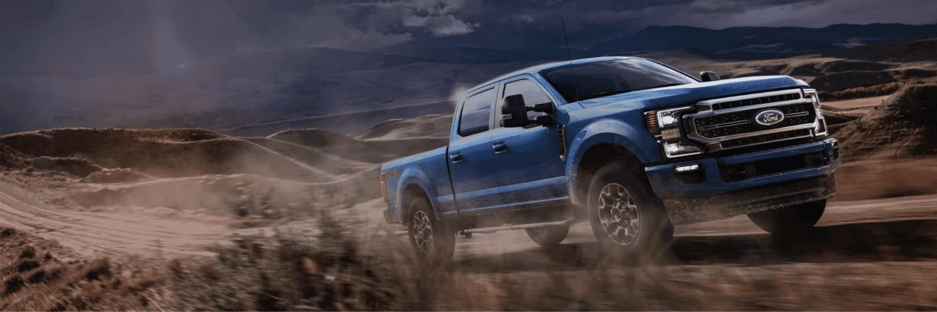 Ford Super Duty Chassis Cab with aftermarket flat bed working on logging site