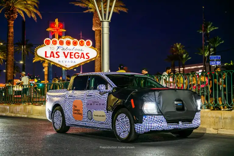 Camouflaged Ford Fathom prototype, front three-quarter view under the Las Vegas sign