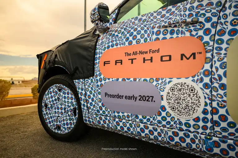 Camouflaged Ford Fathom prototype driver door showing the FATHOM nameplate