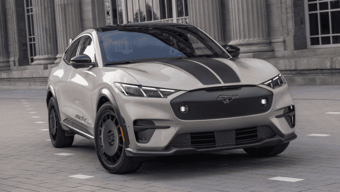 Tan 2025 Ford Mustang Mach-e with racing stripes