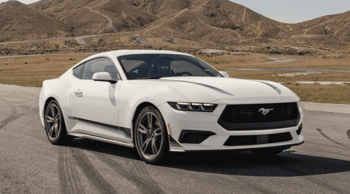 White 2025 Ford Mustang driving on road