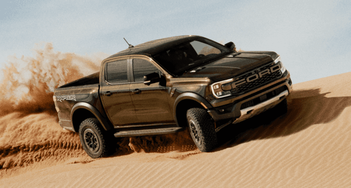 Green 2025 Ford Ranger Raptor Driving off-road