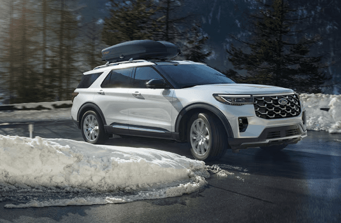 White 2025 Ford Explorer with case on roof