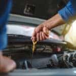 man performing oil change