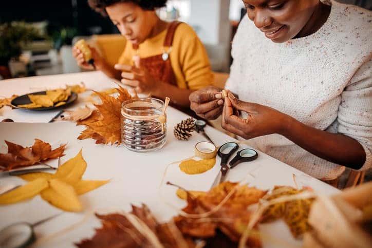 Mother and daughter make autumn decoration at home