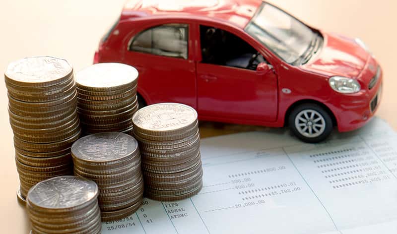 quarters next to a red car
