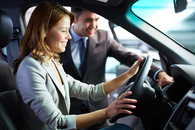 sales person showing a vehicle