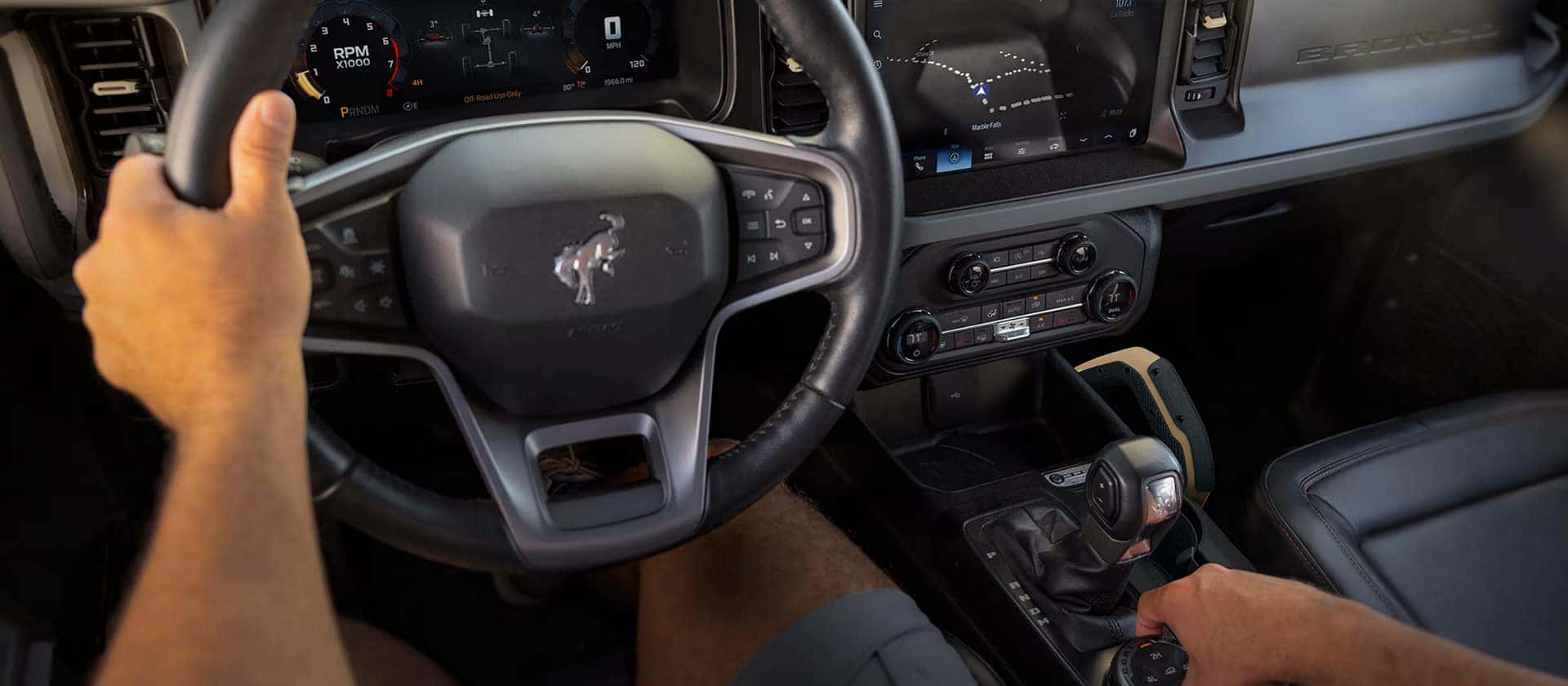 and interior view of the infotainment system and all the knobs and buttons