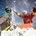 Two friends are enjoying snowboarding on a mountain near Albany, NY.