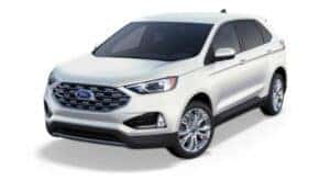 A white 2020 Ford Edge Titanium is angled left.