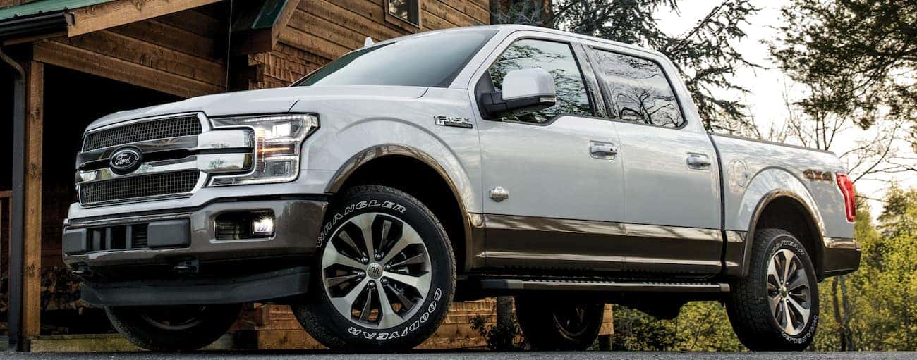 A white 2020 Ford F-150 is parked in a driveway.