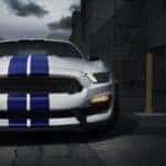 A white 2020 Ford Mustang GT350 is parked in a dark ally at night near Albany, NY.