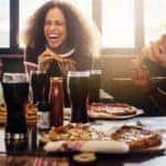 A group of friends are enjoying food at a local Schenectady NY restaurant.