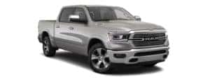 A silver 2020 Ram 1500 is facing right.