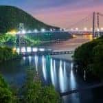 The Bear Mountain bridge near Hyde Park in NY is lit up at night.