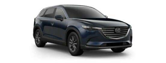A blue 2020 Mazda CX-9 Sport is angled right.