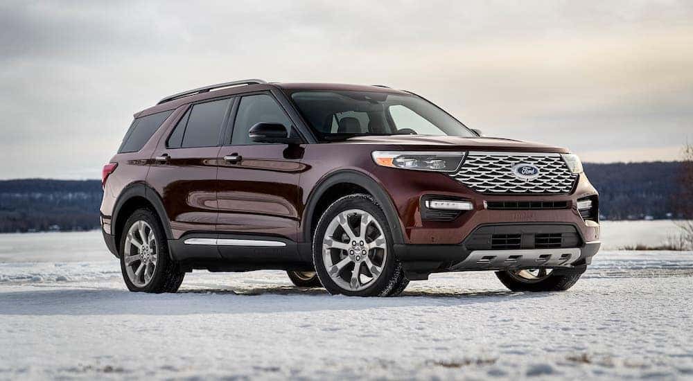 A maroon 2020 Ford Explorer is parked in a snowy field outside Albany, NY.