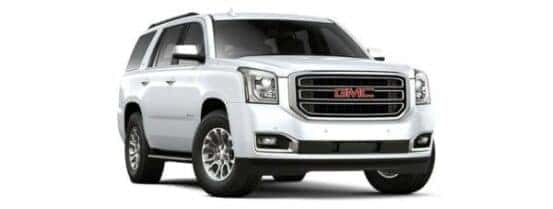 A white 2020 GMC Yukon is angled right.