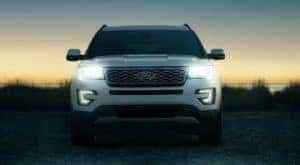 A white 2017 Ford Explorer is shown from the front at dusk.