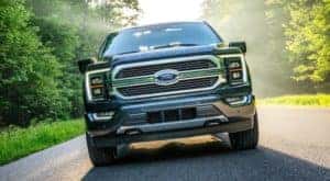 A blue 2021 Ford F-150 is shown from the front after leaving a Ford diesel truck dealer near you.