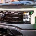 A close up of the grille of a 2021 Ford Lightning is shown at a Ford pre-order dealer.