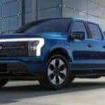 A blue 2022 Ford F-150 Lightning is shown during a 'reserve a Ford' process.