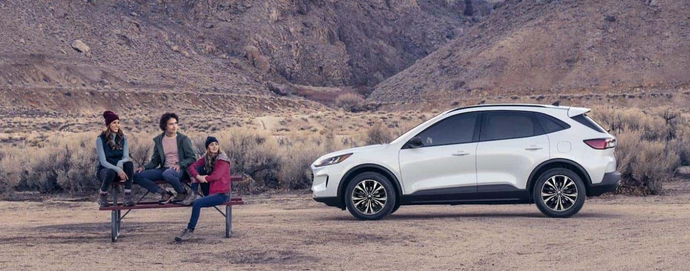A white 2022 Ford Escape SE is shown from the side during a 2022 Ford Escape vs 2022 Honda CR-V comparison.