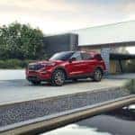 A red 2021 Ford Explorer ST-Line is shown parked in a modern driveway.