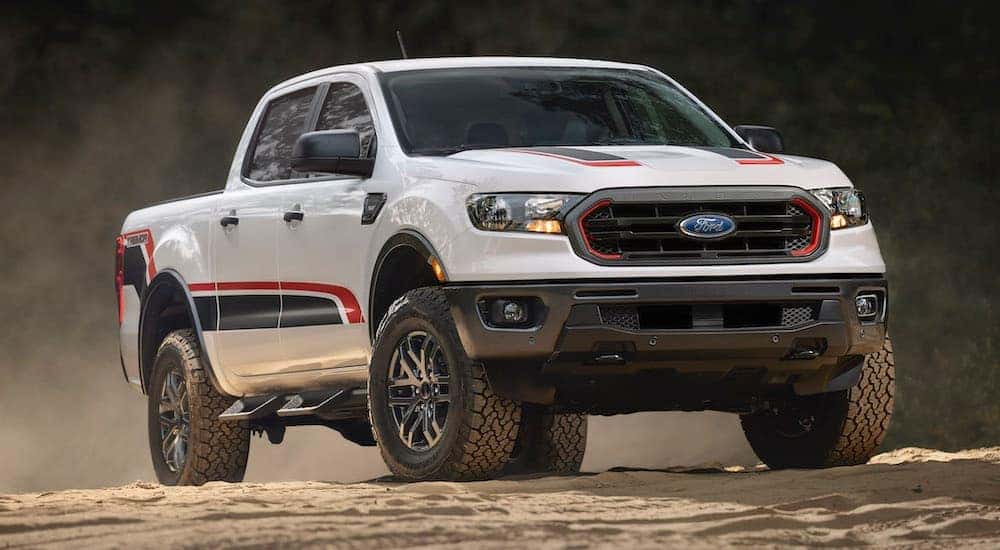 A white 2022 Ford Ranger Tremor is shown from the front at an angle while parked on dirt.