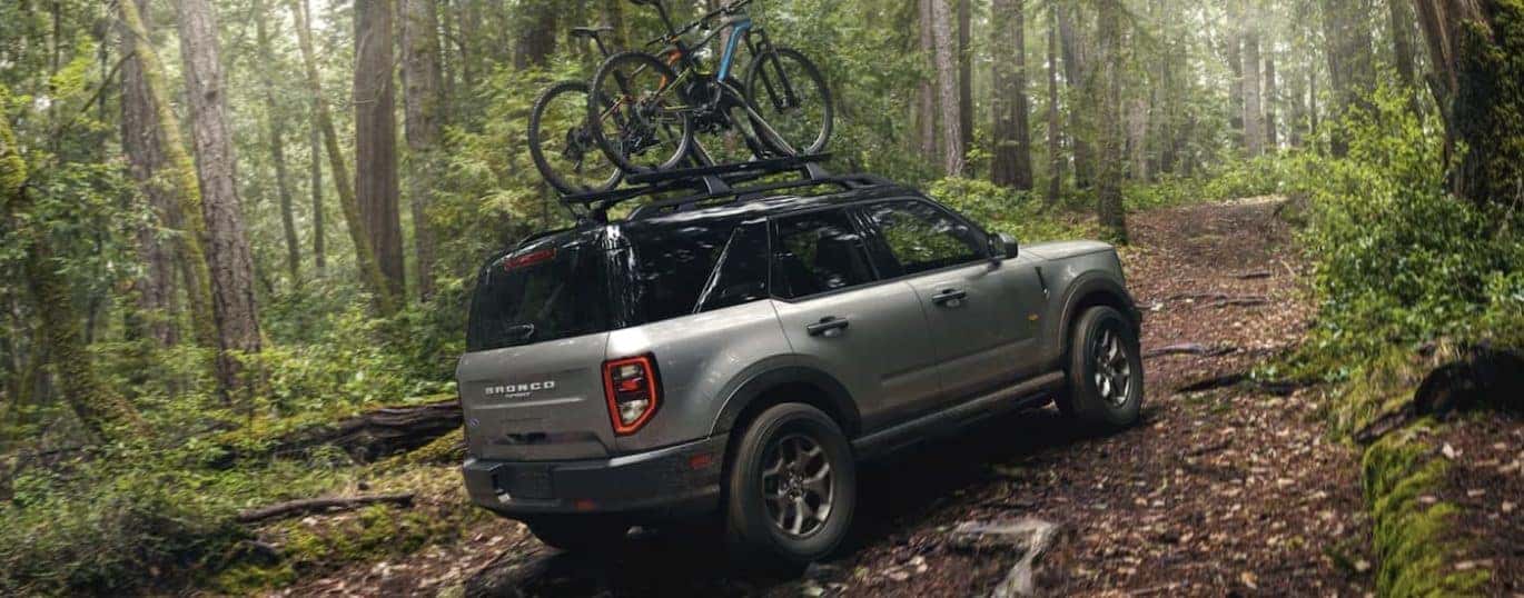 A grey 2022 Ford Bronco Sport is shown off-roading during a 2022 Ford Bronco Sport vs 2022 Jeep Renegade comparison.
