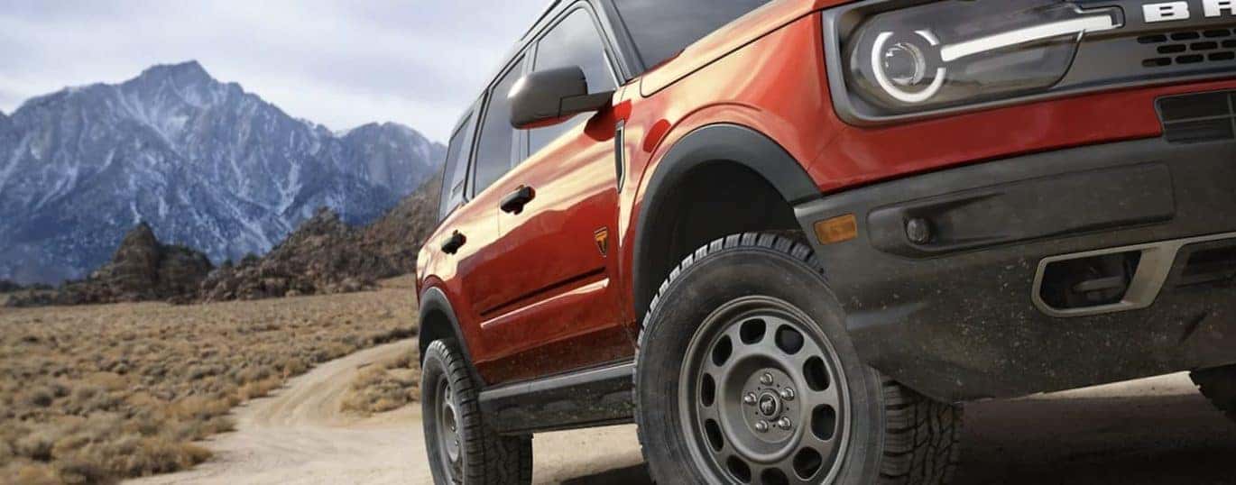 A red 2022 Ford Bronco Sport is shown in close up.