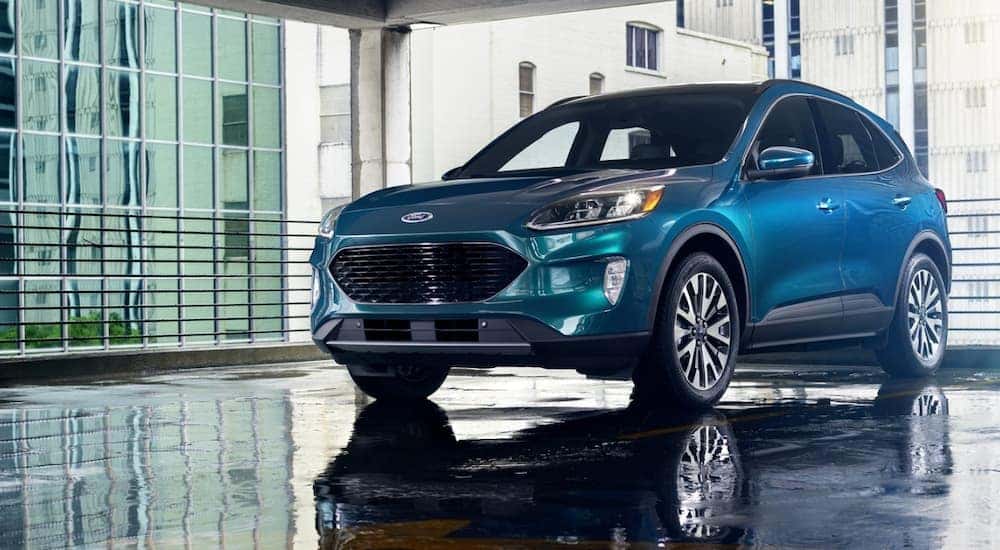 A blue 2020 Ford Escape is shown parked in a parking garage.
