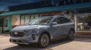 A grey 2023 Ford Escape is shown in front of a shop after visiting an Albany Escape dealer.