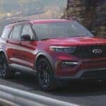 A red 2021 Ford Explorer ST is shown from the front at an angle after leaving a certified used SUV dealer.