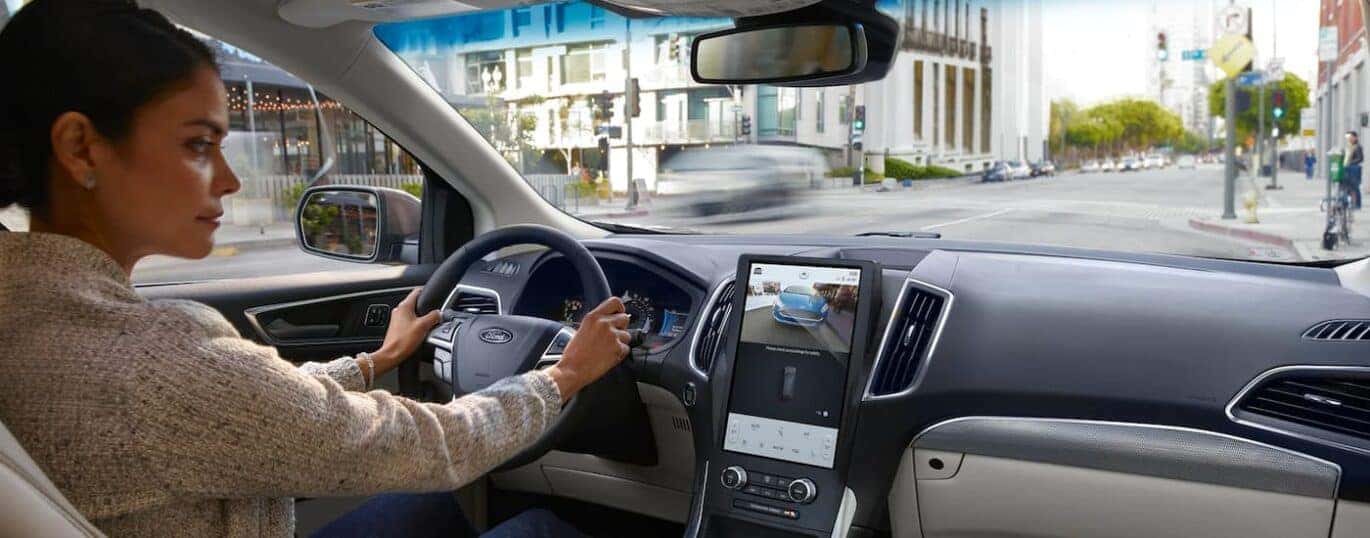 A person is looking at the rear view camera in a 2023 Ford Edge.