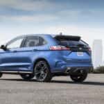 A blue 2019 Ford Edge ST is shown from the rear at an angle.