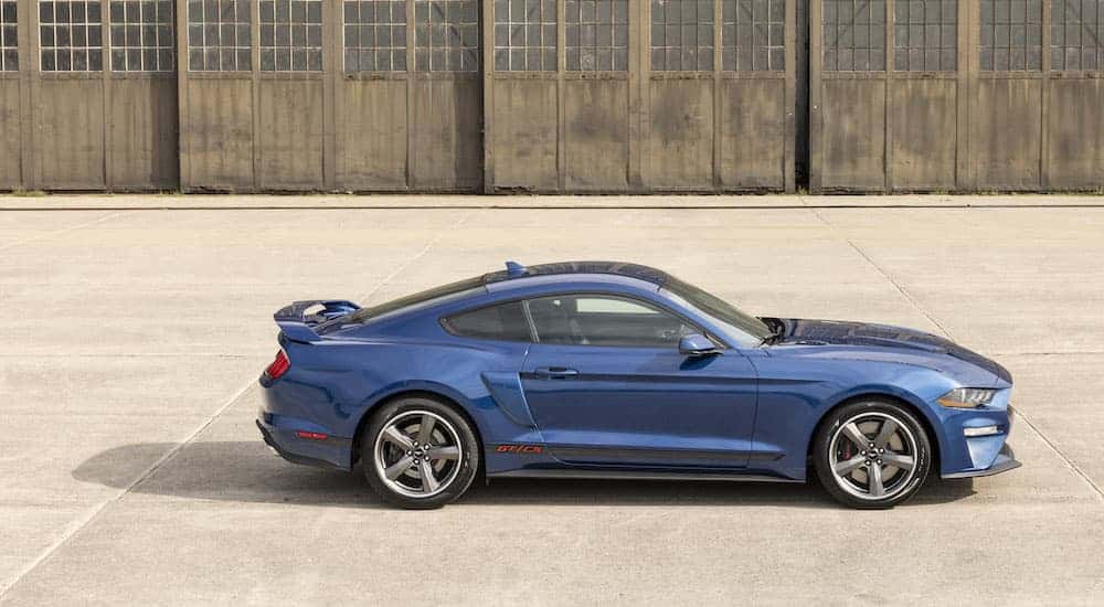 A blue 2022 Ford Mustang GT C/S is shown from the side.