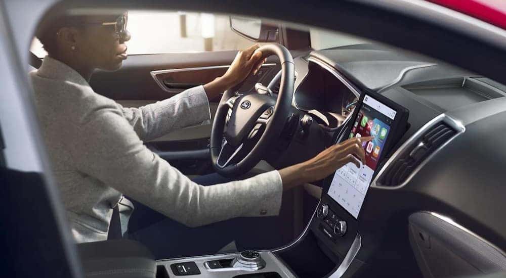 The black interior and dash of a 2023 Ford Edge is shown.
