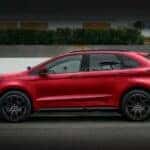 A red 2023 Ford Edge is shown parked on a street after visiting a DePaula Ford Edge dealer