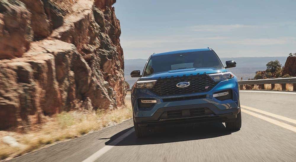 A blue 2021 Ford Explorer ST is shown from the front.