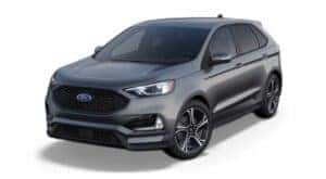 A grey 2023 Ford Edge ST is angled left.