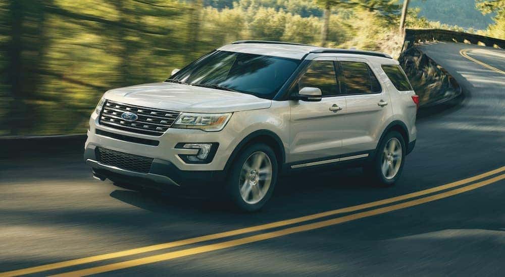 A white 2018 Ford Explorer is shown from the front after leaving a dealer that has a used Ford Explorer for sale.