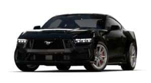 A black 2024 Ford Mustang GT Premium is angled left.