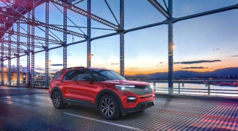 A red 2021 Ford Explorer ST is shown from the front at an angle after leaving a Amsterdam Ford dealership.