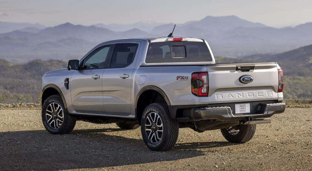 A silver 2024 Ford Ranger Lariat is shown from the rear at an angle after leaving a Amsterdam Ford dealership.