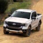 A white 2024 Ford Ranger XLT is shown from the front.