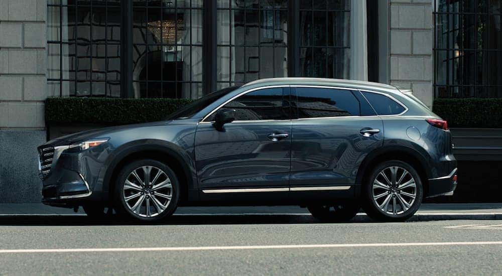A silver 2021 Mazda CX-9 is shown parked near a building after visiting a used car dealer near Bethlehem.